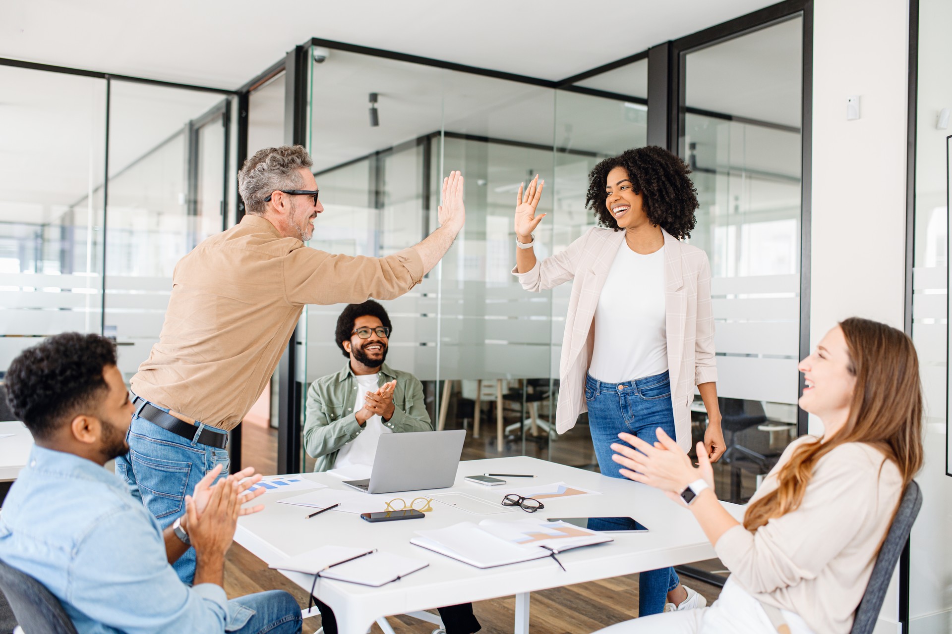 The colleagues exchange a high-five
